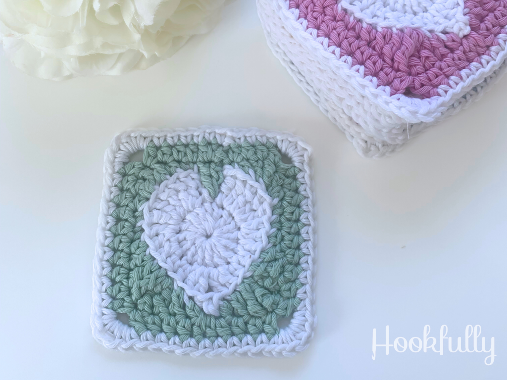Crochet heart granny square Free pattern - white crochet heart in a mint green granny square